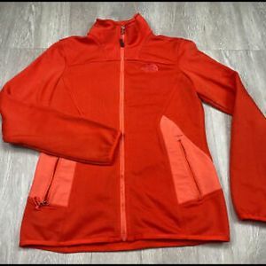 Orange north face zip up jacket